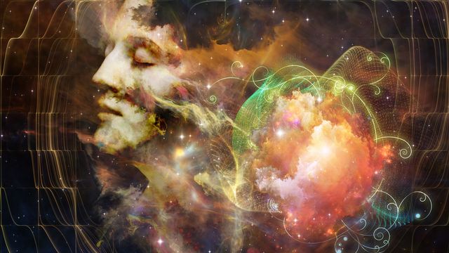 Computer generated image of a person's face in a nebulous cloud 